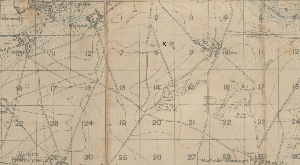 A portion of an old map on which an "x" has been marked just west of the town of Hamel.