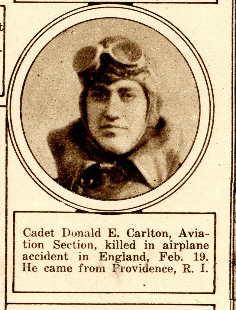 From a somewhat yellowed newspaper, a photo of Carlton's face, in flying helmet with goggles on forehead, in oval frame, captioned "Cadet Donald E. Carlton, Aviation Section, killed in Airplane accident in England, Feb. 19. He came from Providence, R.I."