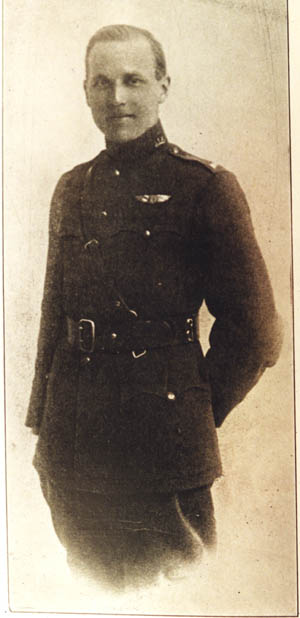 Photo of a young man in uniform with pilot's wings above his left breast pocket.