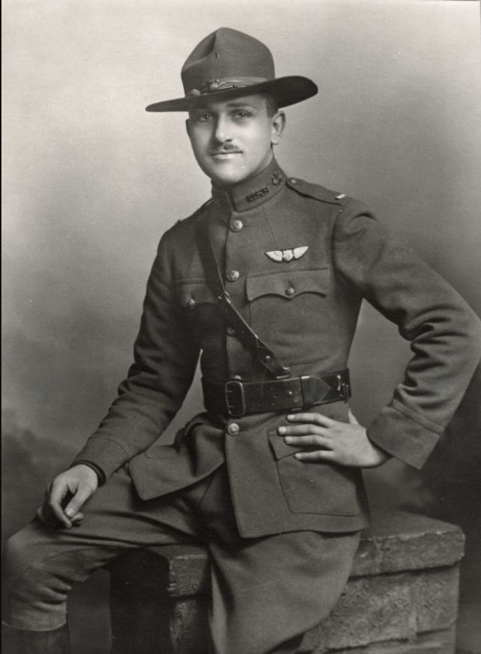 A portrait photo of Hamilton in uniform wearing a campaign hat and Sam Browne belt, with pilot's wings and lieutenant's bars.